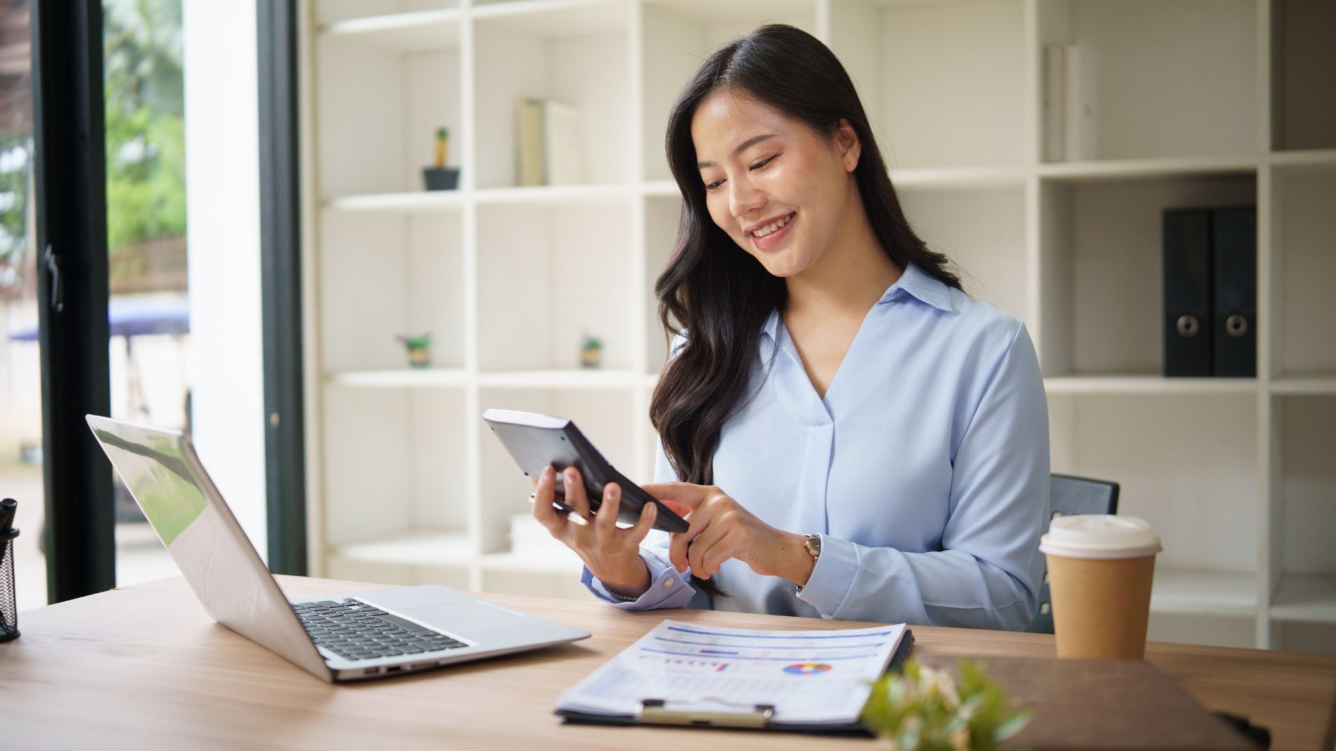 Small business owner reviewing financial dashboard with a bookkeeping partner focused on strategic decision-making.